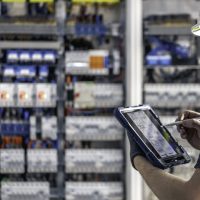 man-electrical-technician-working-switchboard-with-fuses (2)